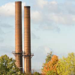 The stacks of the central Cornell Heating Plant in fall
